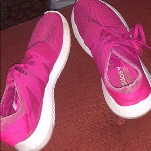 Pink Adidas tennis shoes.